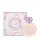 A pastel pink octagonal perfume bottle with intricate embossed designs on the front, accompanied by a matching pastel purple cap and a silver collar. The bottle is displayed next to its elegant white and pink box, labeled "Lunar Musk Edition" with the Gissah brand name prominently featured. The box design includes ornate patterns and accents that complement the delicate and luxurious appearance of the bottle.
