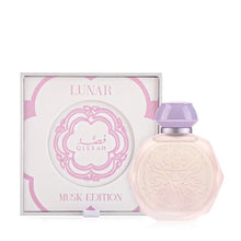 A pastel pink octagonal perfume bottle with intricate embossed designs on the front, accompanied by a matching pastel purple cap and a silver collar. The bottle is displayed next to its elegant white and pink box, labeled "Lunar Musk Edition" with the Gissah brand name prominently featured. The box design includes ornate patterns and accents that complement the delicate and luxurious appearance of the bottle.