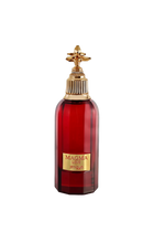 The image shows a bottle of "Magma Love" perfume by Zimaya. The bottle is deep red with a faceted design and a gold label that reads "MAGMA LOVE" and "zimaya" at the bottom. The cap is an ornate gold structure with a decorative, flower-like design on top, adding an element of luxury and sophistication. The overall design of the bottle is bold and elegant, conveying a sense of passion and opulence.