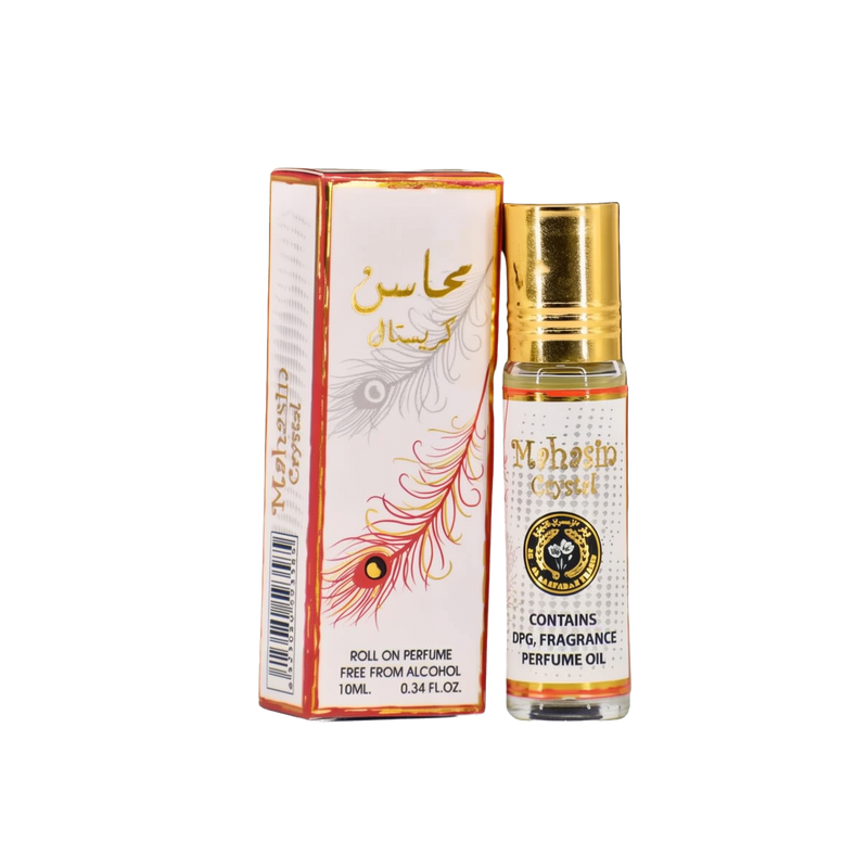 The image shows a product named "Mahasin Crystal," which is a roll-on perfume oil by Ard Al Zaafaran. The product is contained in a small 10 ml (0.34 fl. oz.) glass bottle with a golden cap. The bottle and its accompanying box feature a white design with 