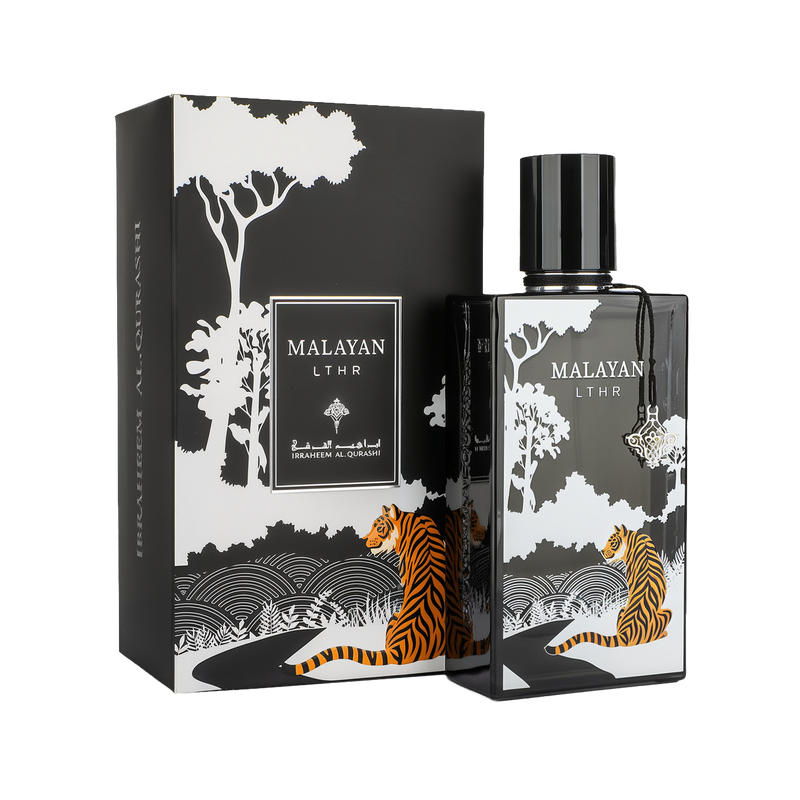 A bold and artistic bottle of Malayan LTHR Eau De Parfum by Ibraheem Al-Qurashi, displayed beside its matching box. The design features a black bottle with white forest silhouettes and an orange-striped Malayan tiger illustration. The bottle is topped with a glossy black cap and adorned with a hanging silver charm. The outer packaging reflects the same jungle theme with trees, a winding path, and a seated tiger, along with the Malayan LTHR label in white.