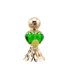 An elegant green perfume bottle with a gold ornate cap and base, featuring a tag that reads 'Malika' in gold and Arabic script, displayed next to a luxurious green box with gold floral patterns and the text 'Malika' in Arabic and English.