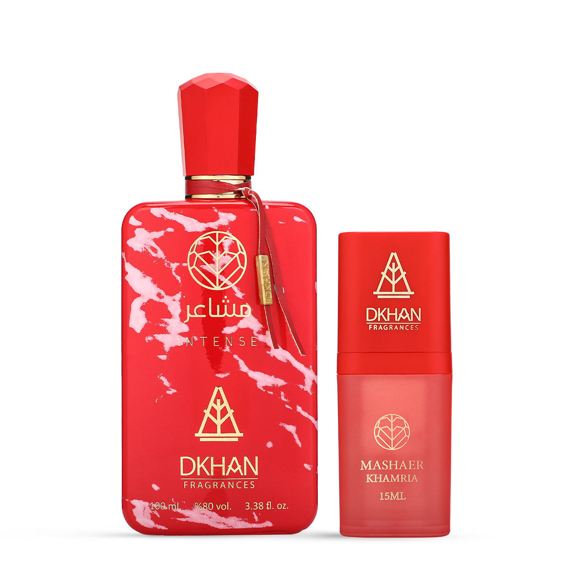 This image features a striking fragrance set from DKHAN Fragrances. On the left, there's a large red perfume bottle with a marbled white pattern, labeled "club INTENSE" and displaying the DKHAN Fragrances logo, along with the quantity "100 ml, 3.38 fl. oz., 80% vol." The bottle has a rectangular shape with rounded edges and a geometric red cap, complemented by a gold tag. To the right is a smaller, cylindrical red bottle with a smooth finish, labeled "MASHAER KHAMRIA" and the volume "15ML".