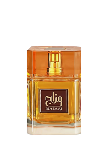 The image shows a bottle of "Mazaaj" perfume. The bottle is rectangular and made of clear glass, showcasing the golden-yellow liquid inside. It has a matching golden-yellow cap with a faceted design. The front of the bottle features a brown label with gold text in Arabic and English, reading "Mazaaj." The overall design is elegant and sophisticated, with a warm color palette that complements the fragrance.
