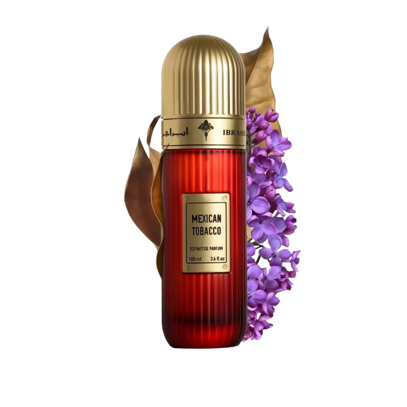 This image features a tall, cylindrical perfume bottle with a gold cap, labeled "Mexican Tobacco" by Ibraheem Al Qurashi. The bottle is red with a vertical gradient, and the volume is indicated as "100 ml / 3.4 fl.oz." Beside the bottle is a spray of purple flowers and a dry tobacco leaf, likely representing the fragrance's notes.