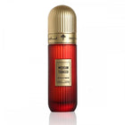 This image shows a tall, cylindrical perfume bottle with a gold cap, labeled "Mexican Tobacco" by Ibraheem Al Qurashi. The bottle has a red gradient color that gets deeper towards the bottom and displays the volume as "100 ml / 3.4 fl.oz." The background is white, which accentuates the vivid red color and the golden accents of the bottle.