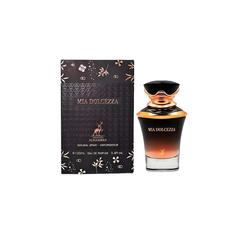 A rectangular black box with gold floral accents labeled “Mia Dolcezza” by Maison Alhambra stands beside a matching black-to-gold ombré glass perfume bottle with a decorative cap, displaying the same product name and brand.