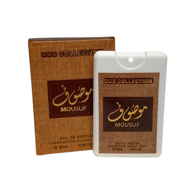The image shows a small, flat, white bottle of "OUD COLLECTION MOUSUF" eau de parfum next to its brown packaging box. The bottle has a square shape with rounded edges and a brown label with gold and white text. It contains 20ml or 0.65 fl oz of the perfume. The box has a textured appearance with a similar color scheme and design as the bottle's label, displaying the product name and size prominently. The design suggests a luxurious and exotic fragrance product.