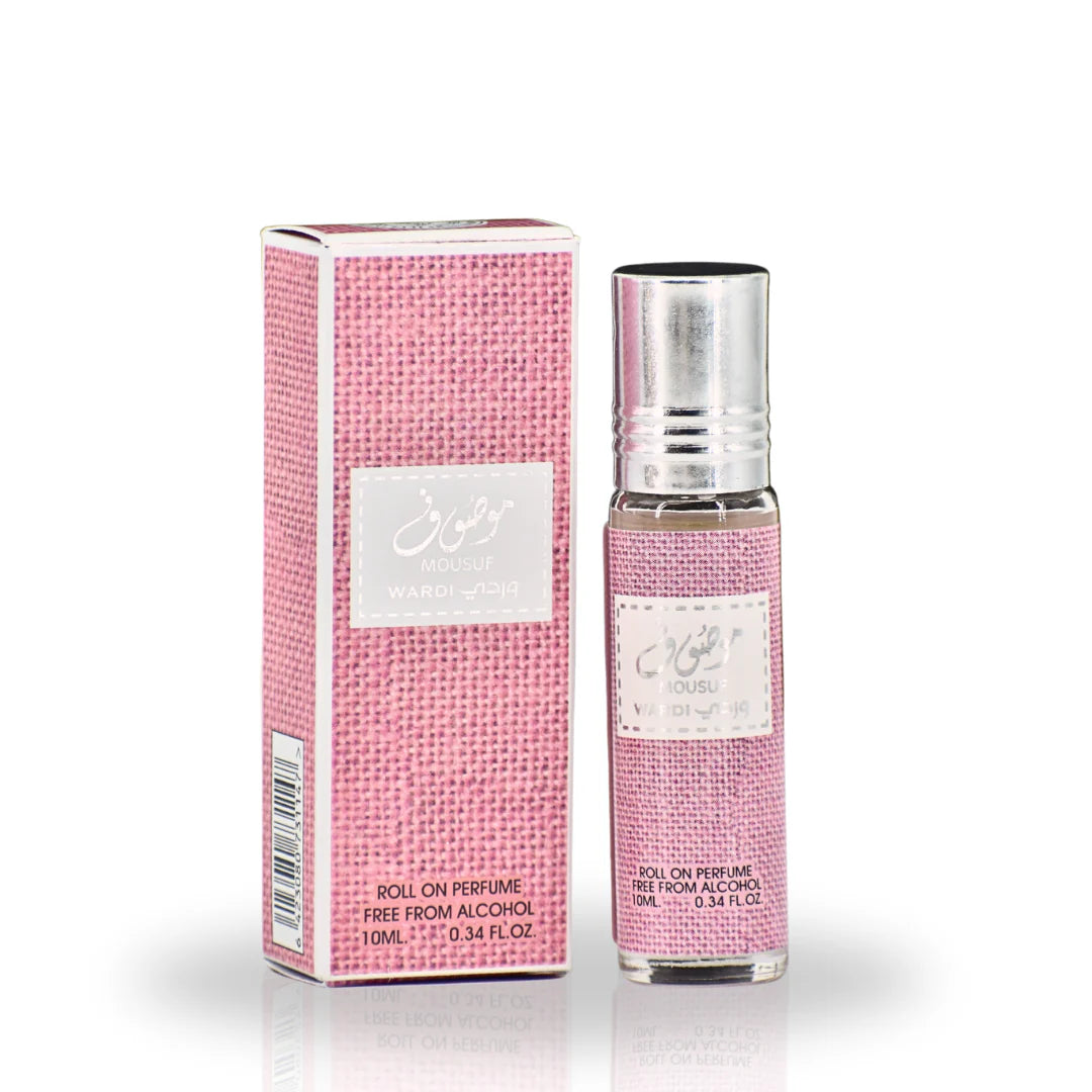 The image shows a product named "Mousuf Wardi," which is a roll-on perfume oil by Ard Al Zaafaran. The product is contained in a small 10 ml (0.34 fl. oz.) glass bottle with a metallic cap. The bottle and its accompanying box are both adorned with a pink textured pattern.