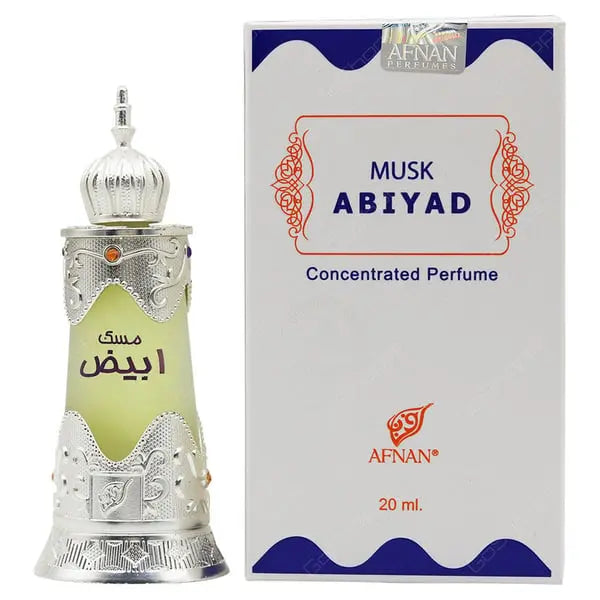 The image shows a bottle of "Musk Abiyad" concentrated perfume by Afnan Perfumes, next to its packaging. The perfume bottle appears to have a traditional design with a silver metallic finish and intricate decorative patterns, topped with a dome-shaped cap. It has a label with Arabic script in green, hinting at the fragrance's oriental inspiration.  The white and blue color scheme of the box contrasts with the silver and green of the bottle, making it stand out.