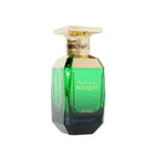 The image shows a luxurious perfume bottle for "Mystique Bouquet" by Afnan Perfumes. The bottle sports a rich gradient of colors from a luminous green at the top to a deep blue at the bottom. It features a wide, flat, gold-colored cap and a gold band around the neck with an elegant, minimalist design. The bottle's faceted design catches the light, adding to the premium feel of the product.  