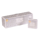 The image shows two boxes of "Bakhoor Marble" by Nabeel Perfumes. The boxes are light grey with intricate silver geometric and floral patterns. Both feature a central white label with Arabic script and the product name in English. Each box also has the brand's gold seal. The larger rectangular box lies behind the smaller square box, which appears to be a miniature version of the larger one.