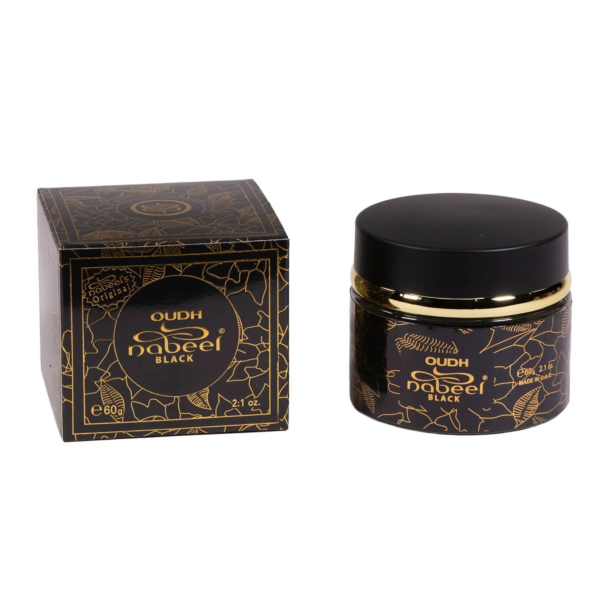 The image features a product from Nabeel Perfumes called "OUDH nabeel BLACK". On the left is a square box with a black base and intricate golden patterns, including what appears to be branches or leaves. The product name is written within a circular golden frame on the box. The box also states the quantity as "60g 2.1 oz." On the right is a matching cylindrical container with a black lid, also adorned with golden patterns and detailing that echoes the design on the box.