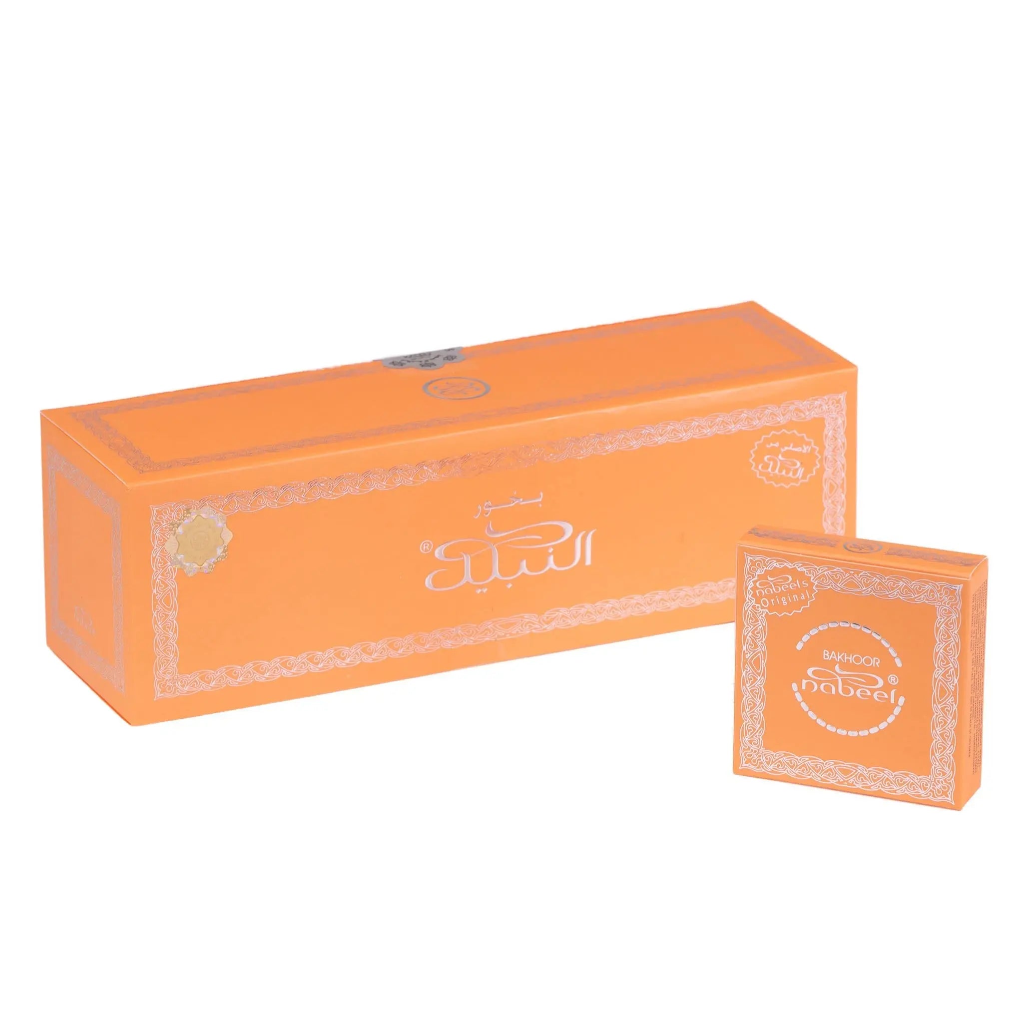 The image shows two boxes of 'Nabeel Bakhoor' incense products. The larger rectangular box and the smaller square box both have an orange background with intricate white lace patterns along the edges. Arabic script and the brand name "Nabeel" are written in white on the boxes, along with the English translation "Bakhoor Nabeel" below the Arabic text. The design of the packaging is elegant and suggests a luxurious home fragrance product with Middle Eastern influences.