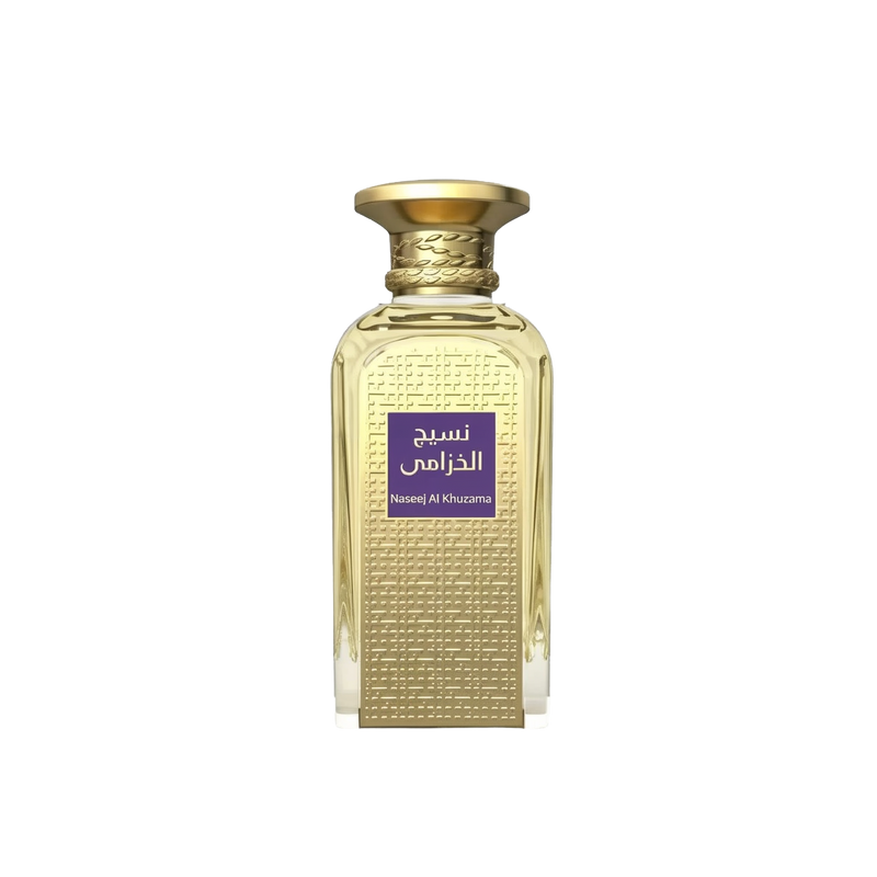 The image is of a perfume bottle with a rich golden color and textured design. The bottle has a rectangular shape with a curved top and a broad, flat base. The cap is a smooth, polished gold matching the bottle's texture. On the front, there is a purple label with Arabic script, which translates to "Naseej Al Khuzama," indicating the name of the fragrance. The text below the Arabic script, in smaller font, is the English transliteration of the name.