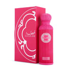 A vibrant pink cylindrical bottle of Gissah One & Only perfume spray, standing next to its matching pink box. 
