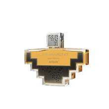 A uniquely designed perfume bottle of "Ornament Pour Femme" by Afnan. The bottle features a geometric silhouette.