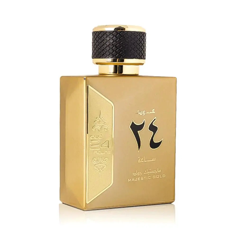 This is an image of a luxurious golden perfume bottle with a textured black cap and a smooth, shiny finish. The front of the bottle features elegant Arabic calligraphy and embossed decorative elements, suggesting a Middle Eastern design influence. Below the calligraphy, there is English text that reads "MAJESTIC GOLD," which may be the name of the fragrance. The bottle has a flat, rectangular shape that gives it a modern and sophisticated appearance.
