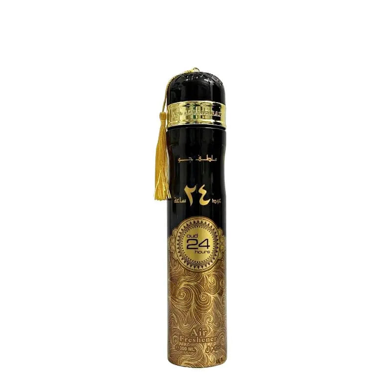 The image shows a tall, cylindrical air freshener can with a glossy black body. The top third of the can has gold Arabic calligraphy and a matching English inscription "Oud 24 hours." Below the text is a decorative golden band with intricate detailing and a gold-colored tassel hanging to one side. The lower two-thirds of the can feature a swirling gold pattern on a black background, and near the bottom, there is a circular seal that reads "Oud 24 hours."