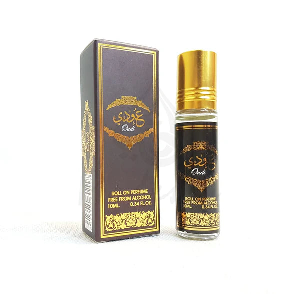 Oudi Roll-On Perfume by Ard Al Zaafaran, featuring a 10ml glass bottle with a gold cap and intricate gold design on the label. The perfume is alcohol-free and comes in a sleek, dark brown box adorned with gold detailing.