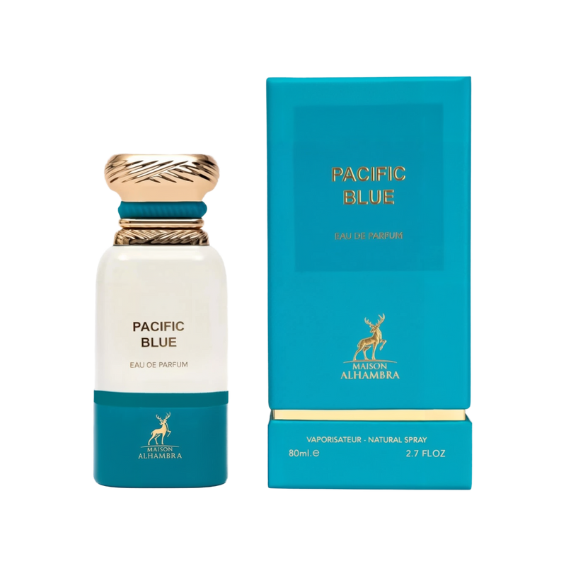 A cylindrical white perfume bottle with a gold and teal cap labeled ‘Pacific Blue Eau De Parfum’ by Maison Alhambra, shown next to its matching teal box with gold lettering and a deer logo."