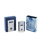 The image showcases a set of perfume products with their packaging. There are two boxes and one perfume bottle, all with a consistent color theme of navy blue and white. The box on the left is navy blue with a textured pattern and a white label that reads "PATCHOULI eau de parfum" along with the "AFNAN" logo.  To the right is another box with a detailed blue and white illustration of a classical garden scene, including a fountain and neatly trimmed hedges.