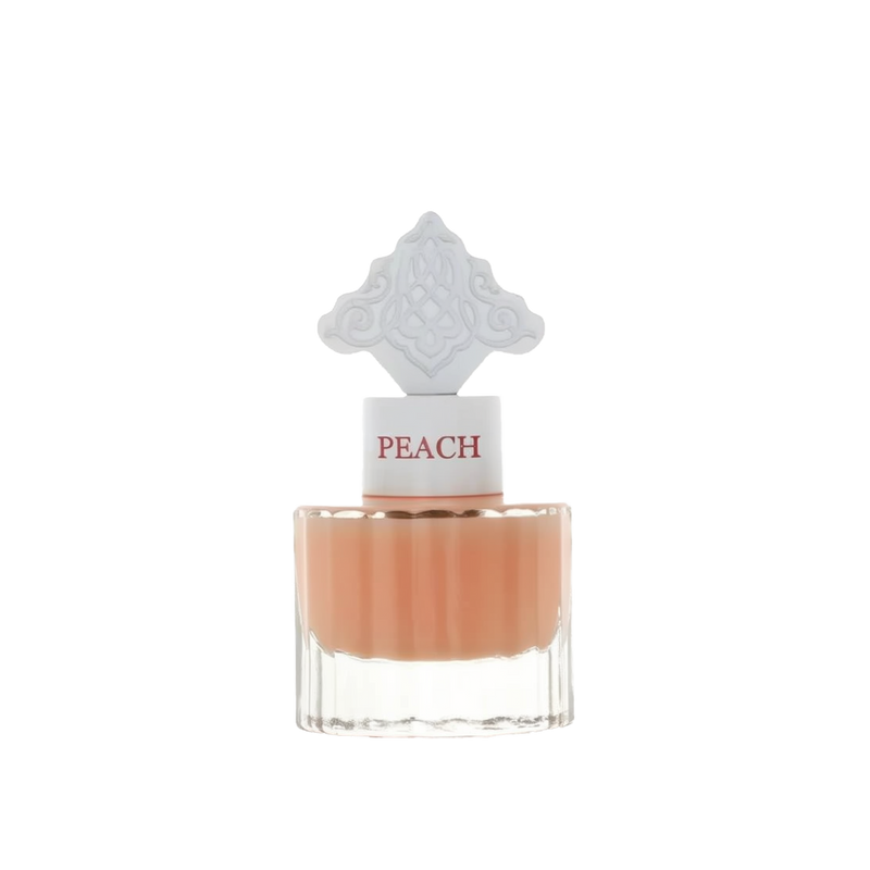 The image features a clear glass perfume bottle filled with a peach-colored liquid. The bottle has a white cap with the word "PEACH" in a peach font color. Atop the cap is an ornate white design, detailed and intricate, possibly inspired by Middle Eastern art.