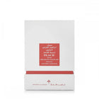 The image displays a white packaging box with a red label for a fragrance product. The label includes the name "PEACH MUSK" in English, with corresponding Arabic script above it. Below, it states "IBRAHEEM AL.QURASHI SPECIAL KHAMRIYA FOR HAIR." A red strip at the box's base matches the label, and the brand's logo is printed in red at the bottom.