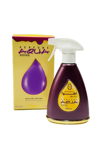 The image displays a room and linen mist spray bottle named "BATOOL" from the AQUA perfume line, along with its packaging. The spray bottle is dark purple with a white spray nozzle and a teardrop-shaped transparent window displaying the name "BATOOL" in Arabic script and "AQUA" in Latin script. The box is yellow with a purple teardrop motif and the text "PERFUME AQUA BATOOL" and "ROOM AND LINEN MIST 375 ml." 