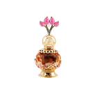 The image features a luxurious perfume bottle from Khadlaj called Pink Musk. The bottle is a decorative orb with a transparent amber body and intricate gold filigree details, including floral motifs with pink and purple crystal embellishments. The cap is a stylized design with three pink petal-shaped crystals, evoking the image of a flower or tulip. The perfume's name and the brand "Khadlaj" are inscribed on the golden neck of the bottle.