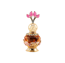 The image features a luxurious perfume bottle from Khadlaj called Pink Musk. The bottle is a decorative orb with a transparent amber body and intricate gold filigree details, including floral motifs with pink and purple crystal embellishments. The cap is a stylized design with three pink petal-shaped crystals, evoking the image of a flower or tulip. The perfume's name and the brand "Khadlaj" are inscribed on the golden neck of the bottle.
