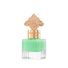 This is an image of a perfume bottle with a clear base and a vibrant green liquid inside. The cap is ornate and gold-colored, featuring an intricate design that suggests an inspiration from Middle Eastern or Islamic art. There is Arabic calligraphy on the gold band around the neck of the bottle, likely indicating the fragrance's name or brand.