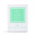 The image displays a fragrance product's packaging box. The box is white with a bright green label framed within a larger white border. The label contains text in both English and Arabic, indicating the fragrance name "PISTACHIO MUSK," the brand "IBRAHEEM AL QURASHI SPECIAL," and the product type "KHAMRIYA FOR HAIR." The box also notes the quantity as "15ml / 0.5 fl.oz."