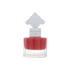 The image shows a perfume bottle with a red liquid and a white cap that has an intricate arabesque design. The label on the bottle, likely in Arabic, suggests that it is a fragrant product intended for hair, possibly part of a special collection by Ibraheem Al.Qurashi. The clear bottom half of the bottle allows the rich red color of the liquid to be prominently displayed, indicating a pomegranate-themed fragrance. The overall design is minimalistic yet elegant.