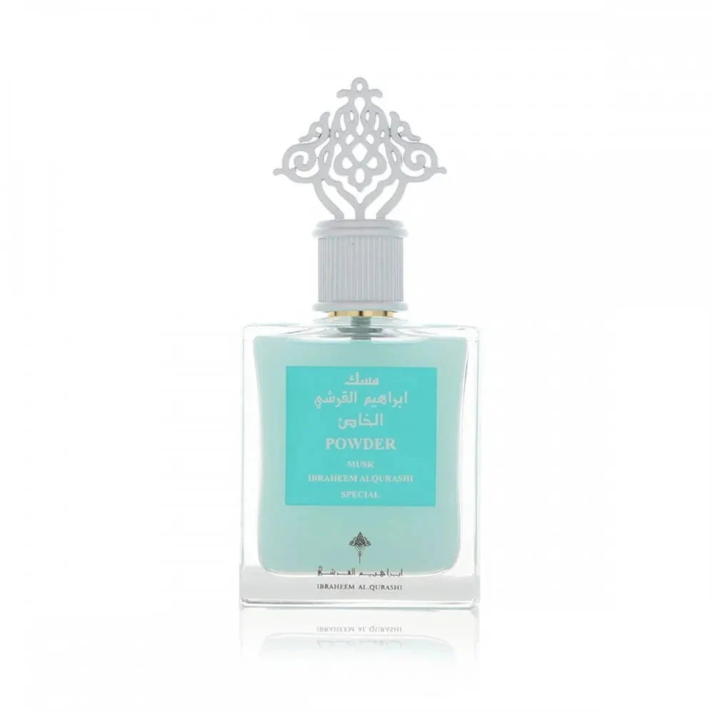 An elegant perfume bottle with a light blue liquid is centered against a pure white background. The bottle features a silver cap with an intricate, decorative design resembling a traditional arabesque motif. The label on the bottle has text in Arabic and English stating "POWDER MUSK, IBRAHEEM ALQURASHI SPECIAL". The branding includes the distinctive logo of Ibraheem Al Qurashi at the bottom of the label.
