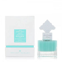The image displays a perfume or hair mist bottle alongside its packaging. The bottle is transparent with a teal-colored liquid and features a distinctive white cap with an ornate, traditional design. The packaging is white with teal accents, and a central label that reads "POWDER MUSK" in English and Arabic. Additional text includes "IBRAHEEM AL QURASHI SPECIAL KHAMRIYA FOR HAIR."