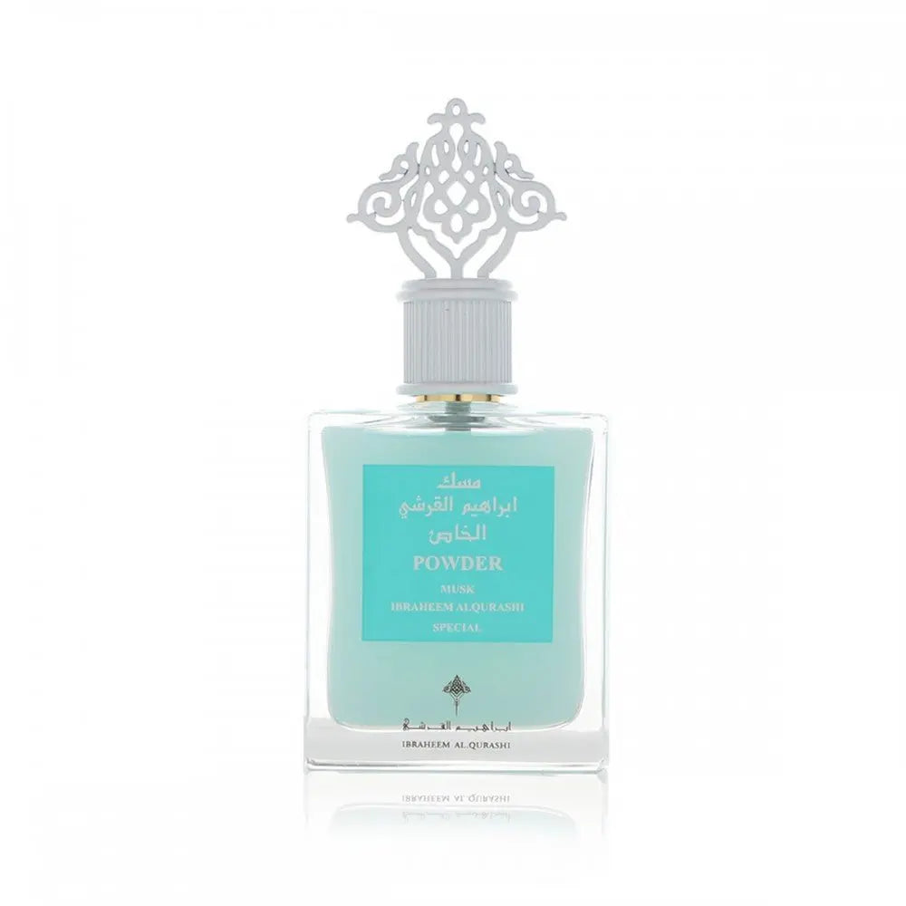 An elegant perfume bottle with a light blue liquid is centered against a pure white background. The bottle features a silver cap with an intricate, decorative design resembling a traditional arabesque motif. The label on the bottle has text in Arabic and English stating "POWDER MUSK, IBRAHEEM ALQURASHI SPECIAL". The branding includes the distinctive logo of Ibraheem Al Qurashi at the bottom of the label.