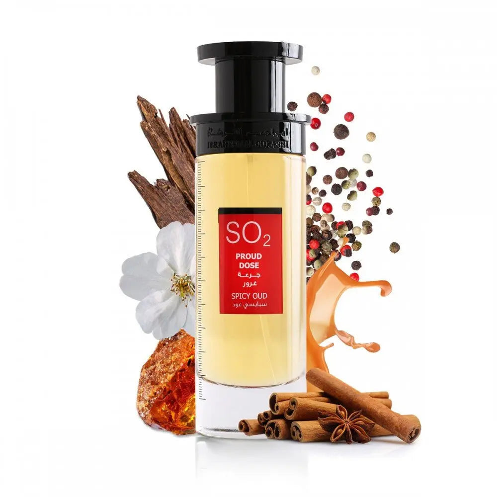 An image of a tall, rectangular perfume bottle with a yellow to amber gradient liquid and a black cap. The label has a prominent red rectangle with the text "SO2 PROUD DOSE SPICY OUD" in both English and Arabic. The product is presented with visual elements that suggest its fragrance notes: white flowers, cinnamon sticks, star anise, amber resin, and a sprinkle of multicolored peppercorns.