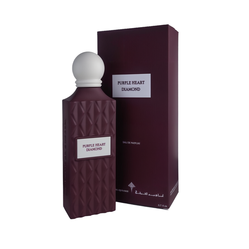 A regal bottle of Purple Heart Diamond Eau De Parfum by Ibraheem Al-Qurashi, displayed next to its matching box. The bottle features a deep plum-purple color with a quilted diamond texture and a rectangular white label with the name 'PURPLE HEART DIAMOND' in purple text. It is topped with a smooth, matte white spherical cap. The box shares the same rich purple tone and minimalist design, with the fragrance name printed on a white label on the front.