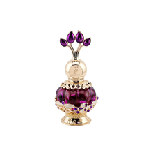 An elegant purple perfume bottle with a gold ornate cap featuring purple gemstone accents, displayed next to a luxurious purple box adorned with gold floral patterns and the text 'Purple Musk' in gold letters.