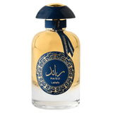 The image shows a perfume bottle with the following details:  The bottle is oval-shaped with a clear glass body, filled with a yellow-colored liquid perfume. It has a navy blue cap that is dome-shaped, complementing the bottle's design. Around the neck of the bottle, there's a navy blue ribbon tied in a simple knot. The front of the bottle features a round navy blue label with gold ornamental patterns around the edge.