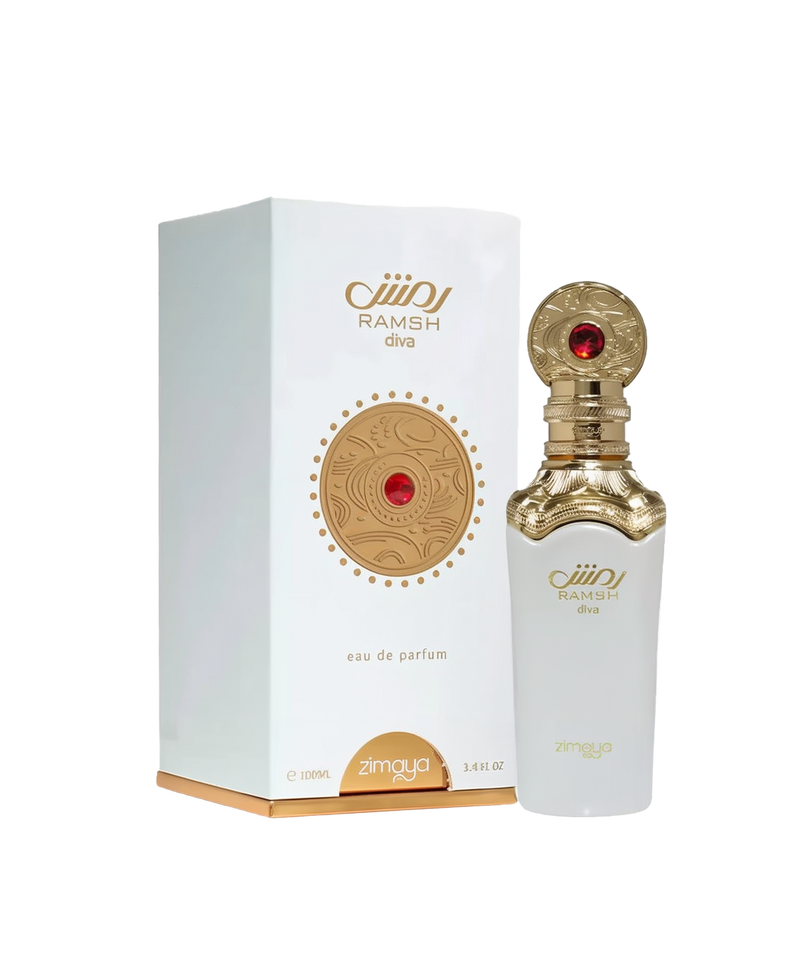 A bottle and packaging of Ramsh Diva Eau De Parfum by Zimaya. The perfume bottle is sleek and white with a gold ornate neck and cap, featuring engraved patterns and a striking red gemstone-like accent. The front label reads "RAMSH diva" and "zimaya" in gold lettering. The matching white box includes a gold circular emblem with red detailing and the same branding, with gold edging along the bottom. The design conveys elegance, luxury, and a regal feminine touch.