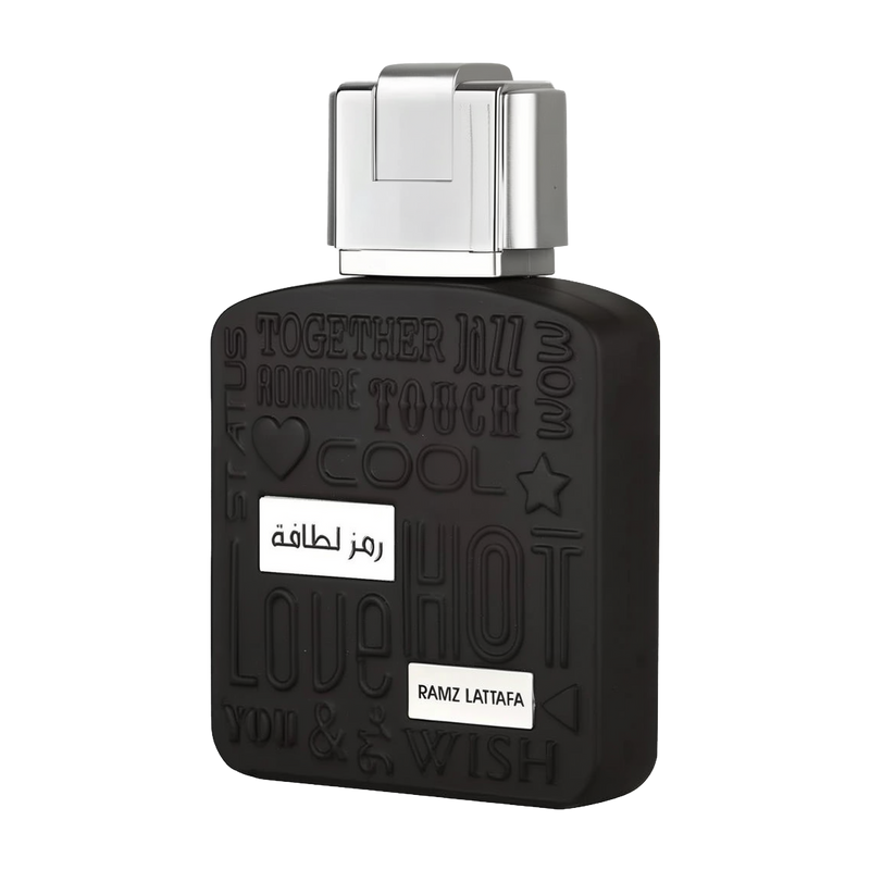 A close-up of the black bottle of "Ramz Lattafa" Eau de Parfum. The bottle's design includes embossed words like "Together," "Jazz," and "Touch" in varying styles. A metallic silver cap is on top of the bottle, and the product name is displayed in both Ar