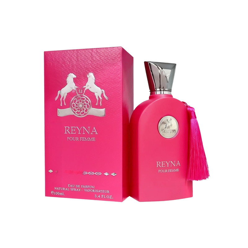 The image shows a bright pink perfume bottle from Maison Alhambra named "Reyna Pour Femme." The bottle has a sleek, rounded design with a silver metallic cap. A silver emblem featuring two horses is displayed on the front, along with the name "Reyna Pour 