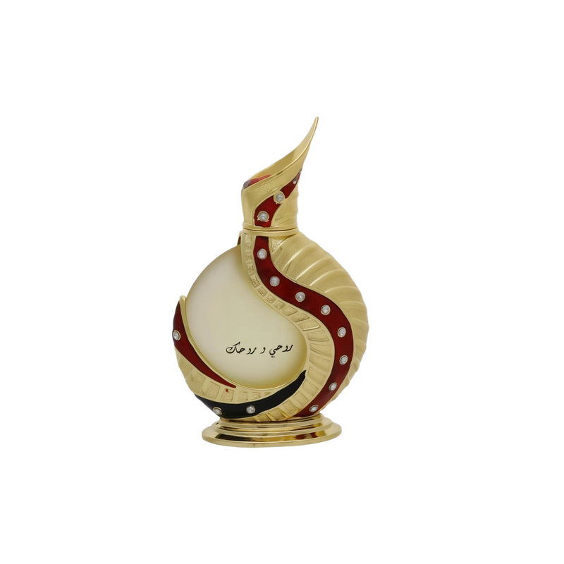 The image shows an intricately designed perfume bottle:  The bottle has a spherical base with a slender, curved neck that extends into a pointed tip, reminiscent of traditional Middle Eastern design. It is predominantly off-white with gold accents and features a decorative red swirl with embedded gem-like stones. Arabic calligraphy is displayed on the lower part of the bottle, adding to its cultural aesthetic. The bottle rests on a small, ornate gold stand.
