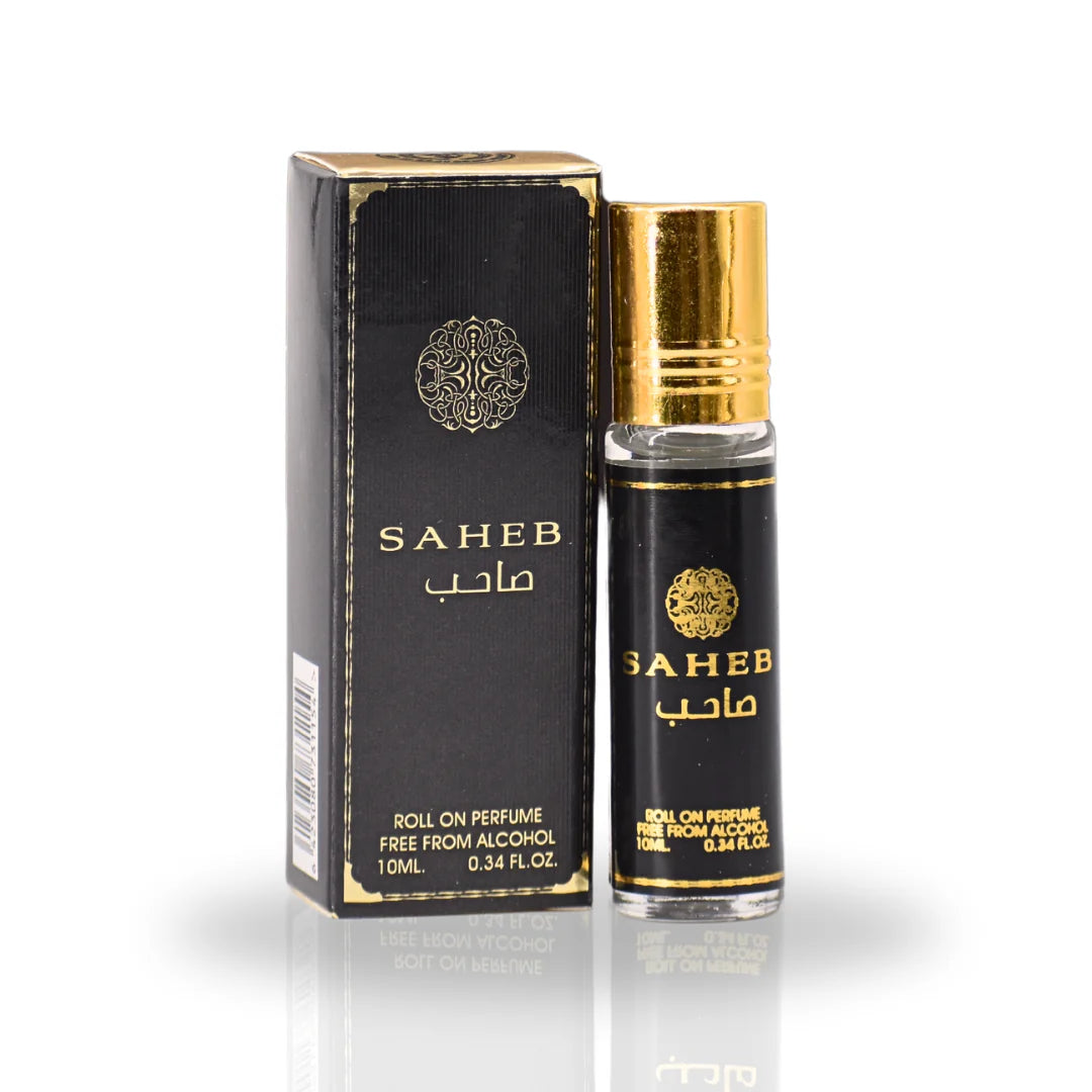 The image shows a product named "Saheb," which is a roll-on perfume oil by Ard Al Zaafaran.  The bottle and its accompanying box feature a sleek black design with gold accents.  The box also has a decorative emblem and a barcode on one side.