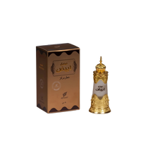 The image displays a perfume bottle and its packaging. The packaging is a rectangular box with a brown color scheme and features decorative patterns, the brand name "AFNAN", and Arabic script which possibly states the fragrance's name. The bottle itself has a white body with intricate golden patterns around its lower half and a detailed golden cap that appears to have a traditional or perhaps Middle Eastern design.