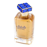 A square glass perfume bottle with a golden-yellow liquid. The bottle has a textured design on the lower half and a smooth upper half with the name "SHAFAQ" in blue letters and Arabic script above it. The cap is a distinctive square shape with blue and white checkered facets. At the base of the bottle, in smaller print, is "By Ard al Zaafaran." The background is plain white.