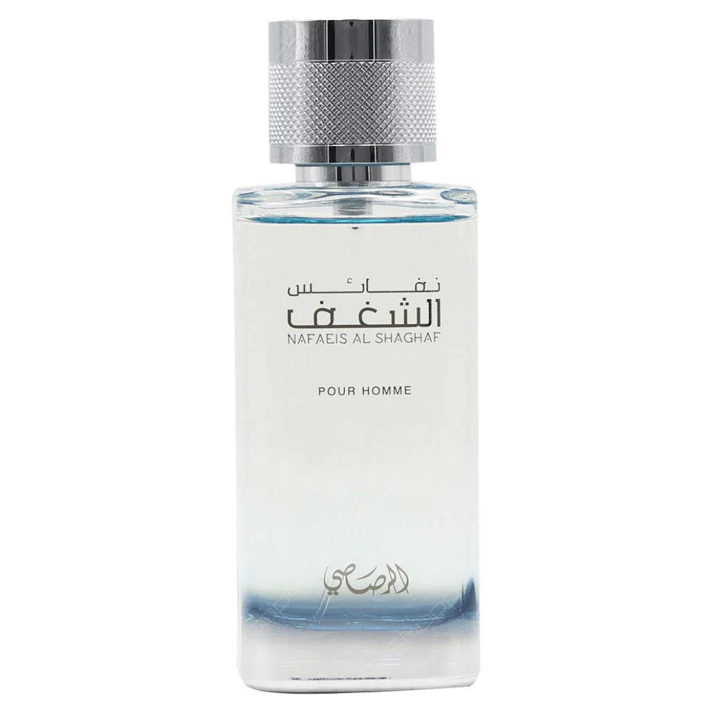 A transparent glass cologne bottle with a silver knurled cap, featuring a blue ombre effect at the bottom. The bottle has "NAFAEIS AL SHAGHAF" written in Arabic script and "POUR HOMME" in English below, indicating that it is a men's fragrance. The overall design is modern and sleek with a masculine touch.