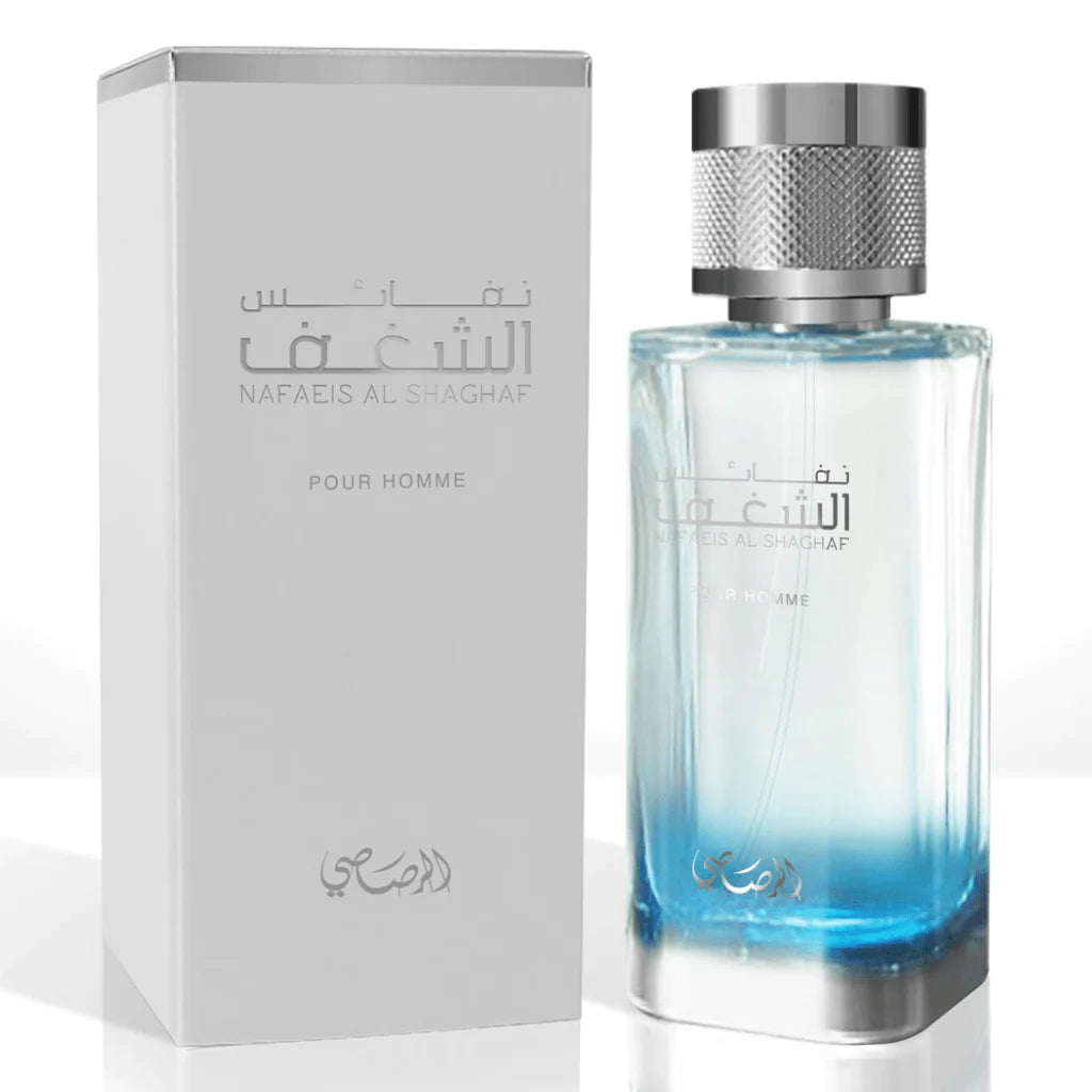 A metallic silver box with the embossed text "NAFAEIS AL SHAGHAF POUR HOMME" in Arabic and English, alongside a clear glass perfume bottle with a blue tint at the base and a knurled silver cap. The box and bottle design present a sophisticated and contemporary look, suggesting the fragrance is a modern, masculine scent.